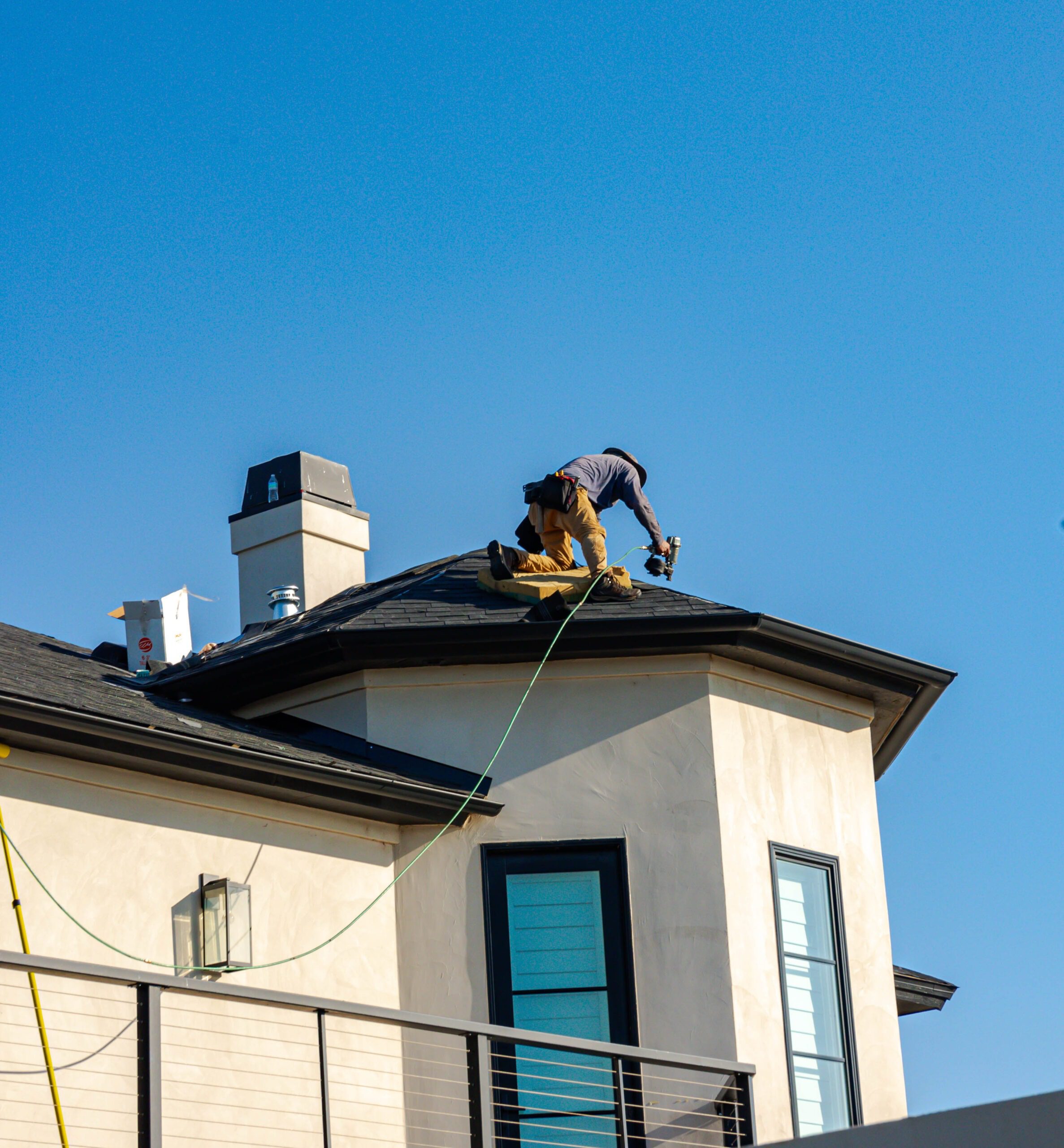man fixing roof